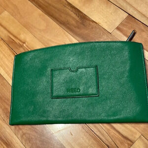 REED green faux leather zipper closure clutch.